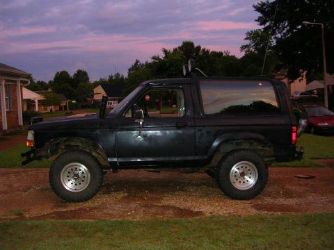 1989 Ford Bronco II - This 1989 Ford Bronco II is shown in profile, equipped with off-road tires and auxiliary lights.