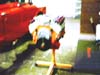 1970 GMC C/K Pickup - A person is seen working out on a weight bench, with a bright red object partially visible in the background.