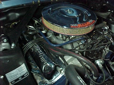 1968 Mercury Cougar - Close-up of an engine bay a chrome air cleaner with a "427 HIGH PERFORMANCE" decal and visible wiring.