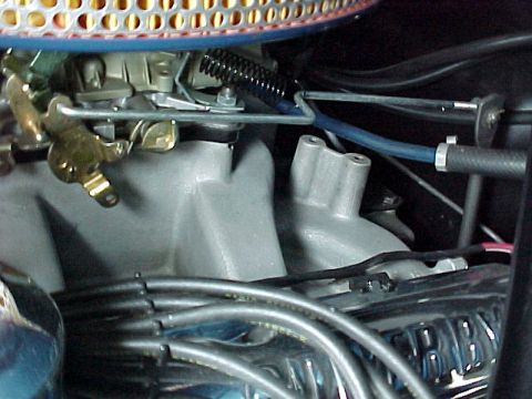 1968 Mercury Cougar - This image shows a close-up view of engine components including the carburetor and spark plug wires.