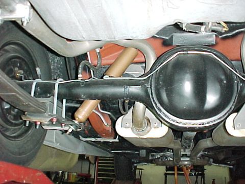 1968 Mercury Cougar - The underside of a vehicle shows the rear axle assembly, suspension components, and exhaust pipes, with a website watermark at the bottom.