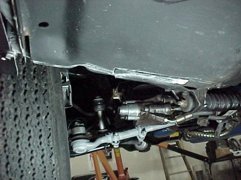 1968 Mercury Cougar - Undercarriage view shows suspension and steering components, with a tire on the left side.