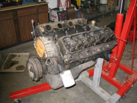 1979 Ford F-150 - Engine removed from a vehicle and mounted on an engine stand for repair or rebuilding.