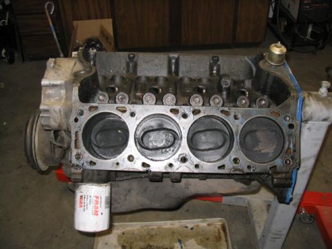 1979 Ford F-150 - Engine block with pistons visible, an oil filter attached, and signs of use.