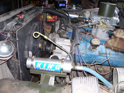 1979 Ford Bronco - Close-up view of an engine bay, showing various components and aftermarket parts.