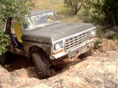 1979 Ford Bronco - This 1979 Ford Bronco is shown off-roading over a rocky path.