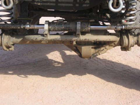 1994 Ford Bronco - Undercarriage view shows heavy-duty off-road modifications to the steering and suspension system.