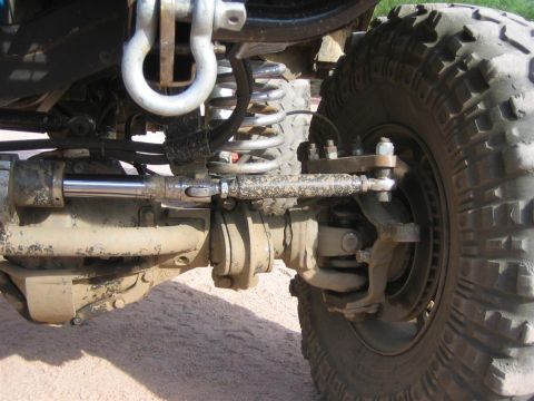 1994 Ford Bronco - Close-up view of the suspension and steering components of an off-road vehicle.