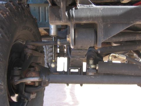 1994 Ford Bronco - Undercarriage view showing suspension and steering parts of an off-road vehicle.