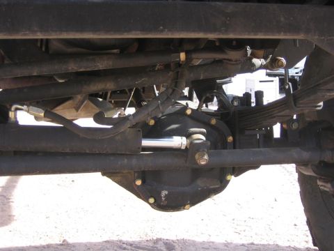 1994 Ford Bronco - This photo shows the underside of a vehicle, focusing on the rear axle and suspension system.