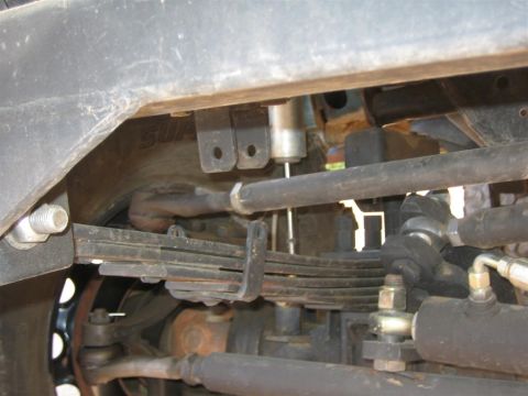 1994 Ford Bronco - Close-up view of the front suspension and steering components on a 1994 Ford Bronco.