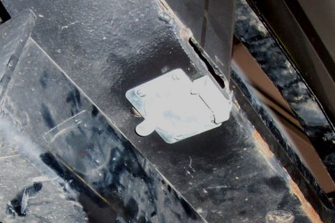 1994 Ford F-150 - A close-up view of a trailer hitch connector attached to a vehicle's frame.