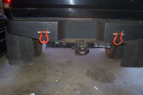1994 Ford F-150 - Rear view of a truck bumper with tow hitch and shackle mounts.