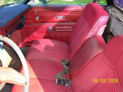 1972 Ford Ranchero - The interior of a 1972 Ford Ranchero shows red fabric seats and door panels.