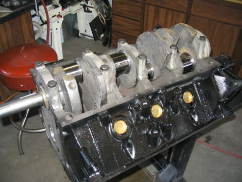1979 Ford F-150 - Close-up view of an engine block and crankshaft assembly, likely a Ford 460 V8, in a workshop setting.