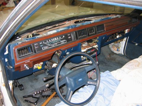 1985 Ford LTD Crown Victoria - Dashboard of a 1985 Ford Crown Victoria LTD undergoing interior restoration, with tools visible.