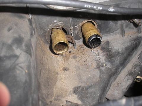 1985 Ford LTD Crown Victoria - Close-up of two brass fittings within a vehicle's interior, one showing damage.