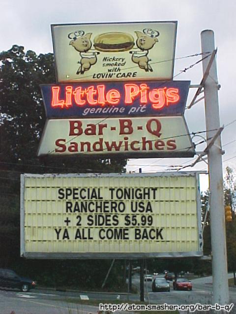2002 Ford Crown Victoria - A roadside sign advertises Bar-B-Q sandwiches, with a marquee displaying a special offer.