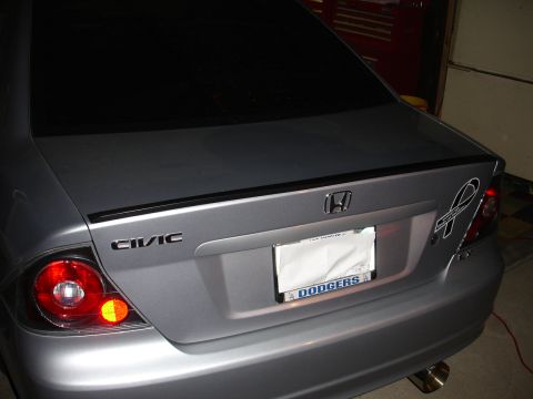 1993 Ford Taurus - Rear view of a silver Honda Civic sedan with a spoiler and custom license plate frame.