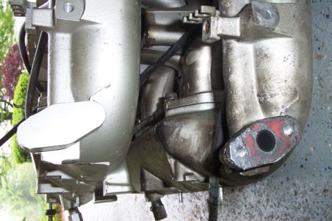 1995 Ford Taurus - Engine intake manifold shown in detail, likely removed for service or replacement.