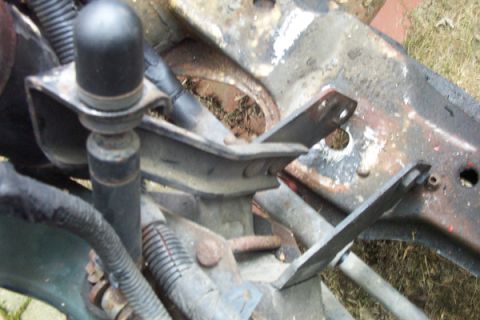 1995 Ford Taurus - Rusty engine mount bracket with wiring detail, likely from an older vehicle.