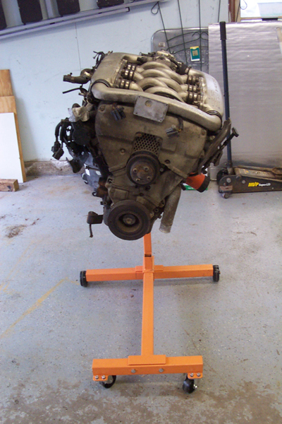 1995 Ford Taurus - Engine assembly mounted on an orange rolling stand, ready for installation or service.