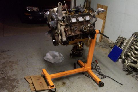 1995 Ford Taurus - Engine removed from a vehicle and placed on an engine stand for service or replacement.