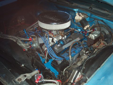 1978 Ford Ranchero - Customized V8 engine bay with aftermarket parts and braided lines. Supermotors.net logo present.