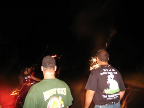 1995 Ford Bronco - People celebrate with sparklers at night, with some text visible on their shirts.