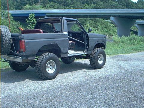 1986 Ford Bronco - This 1986 Ford Bronco is shown with its doors removed and a spare tire mounted on the back.