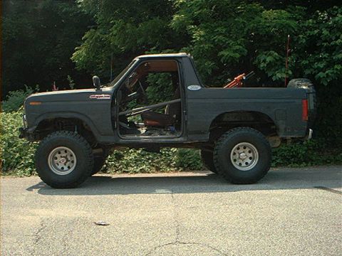 1986 Ford Bronco - Side view of a modified Ford Bronco, likely from the early 1980s, with its doors removed.