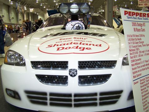 1995 Ford Probe - Front view of a drag car with a prominent supercharger and "Shadeland Dodge" branding.