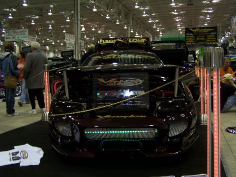 1995 Ford Probe - A customized 1995 Ford Probe is displayed at a car show, a unique grille and spoiler.