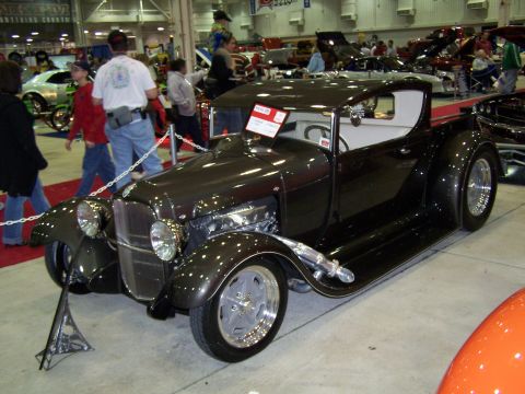 1995 Ford Probe - Custom hot rod pickup truck on display at a car show.