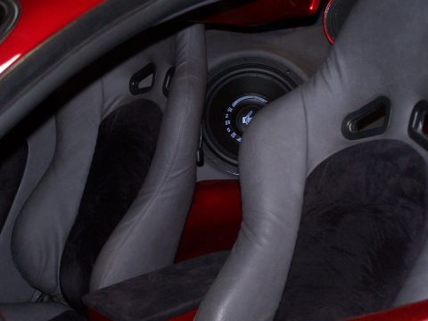 1995 Ford Probe - Custom interior features racing seats and a prominent speaker system, with a watermark indicating 'Supermotors.net'.