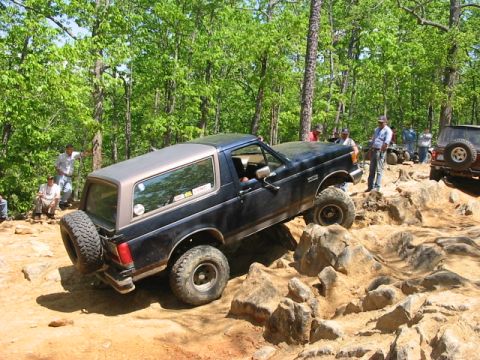 1988 Ford Bronco - Ford Bronco tackling a challenging rocky terrain during an off-road excursion.