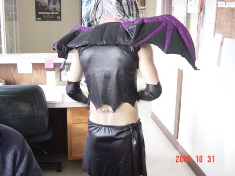 1995 Ford Probe - A person in a bat costume stands in an office, with a date stamp visible in the corner.