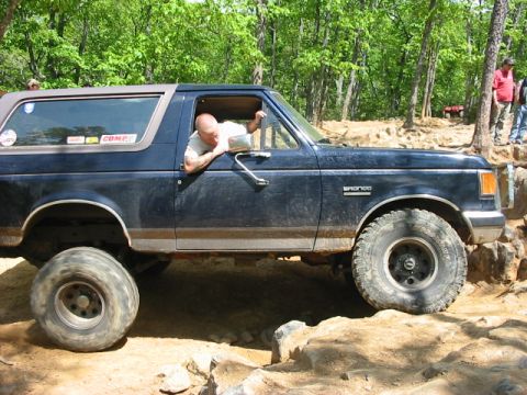 1988 Ford Bronco - This 1988 Ford Bronco navigates a challenging rocky terrain during an off-road excursion.