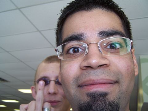 1995 Ford Probe - A selfie captures two men, with the man in the foreground wearing glasses and a goatee, while the man behind him raises a finger.