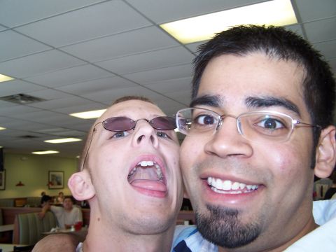 1995 Ford Probe - Two men take a selfie in a restaurant with booths and tables visible in the background.