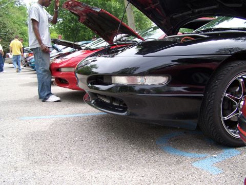 1995 Ford Probe - Several Ford Probes are parked with their hoods open at an outdoor event.