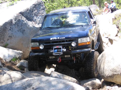 1994 Ford Bronco - This 1994 Ford Bronco is tackling a challenging off-road course with large boulders.