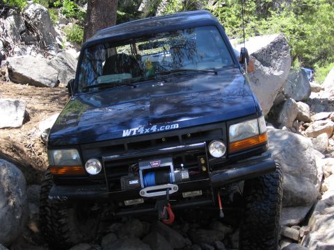 1994 Ford Bronco - This 1994 Ford Bronco navigates a challenging rocky trail, its off-road capabilities.