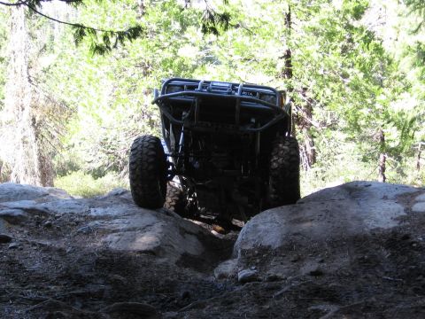 1994 Ford Bronco - This off-road buggy navigates a rocky trail, with its winch clearly visible on the front.