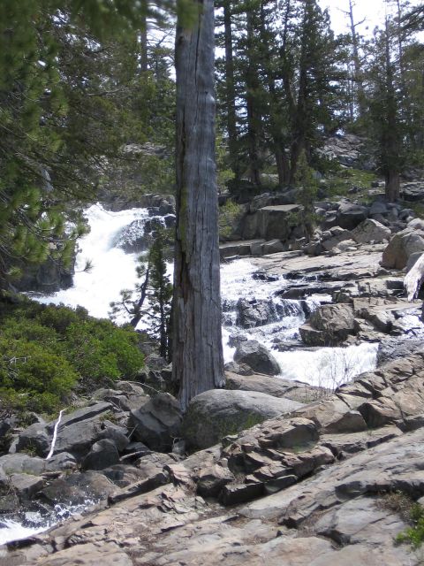 1994 Ford Bronco - A scenic view of a waterfall cascading over rocks in a forest setting.