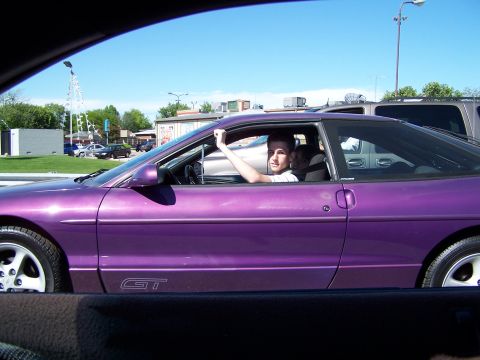 1995 Ford Probe - A purple 1995 Ford Probe GT is seen from the side with a driver inside.