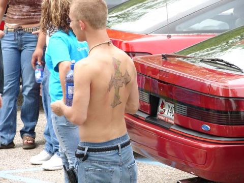 1995 Ford Probe - The rear of a red car is visible, a license plate and text indicating "University of Louisiana".