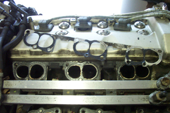 Engine manifold with removed gaskets and ports visible