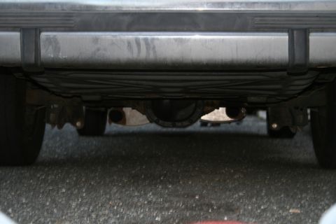 1989 Ford Crown Victoria LTD - Underside view of a vehicle's rear differential and exhaust pipes.