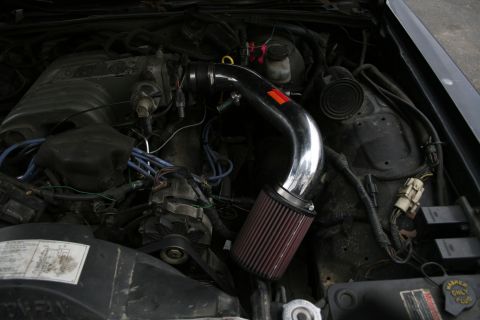 1989 Ford Crown Victoria LTD - Close-up of a car's engine bay, an aftermarket cold air intake system.